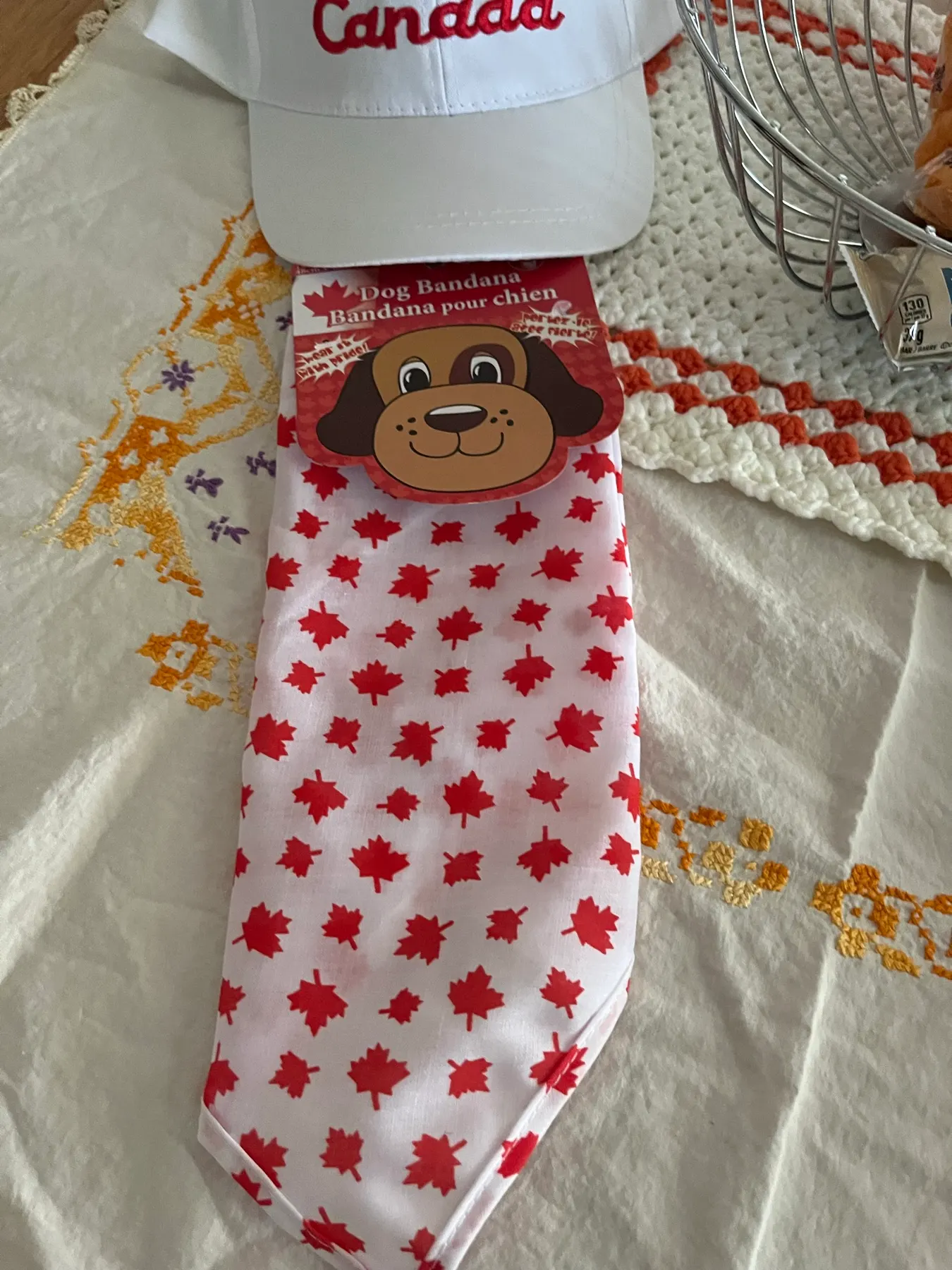 A Canada hat and maple-leaf dog bandana left by the Airbnb host