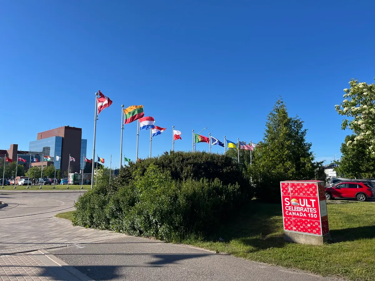International flags flying beside the park in Sault Ste. Marie