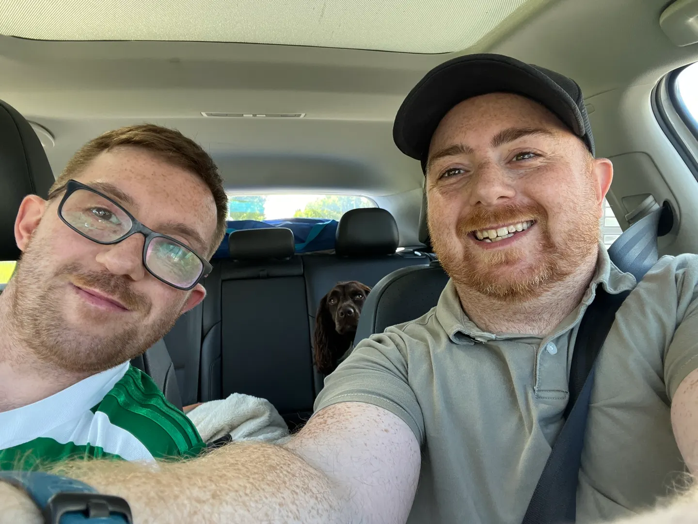 My brother and me in the front seats with Tilly peeking between us
