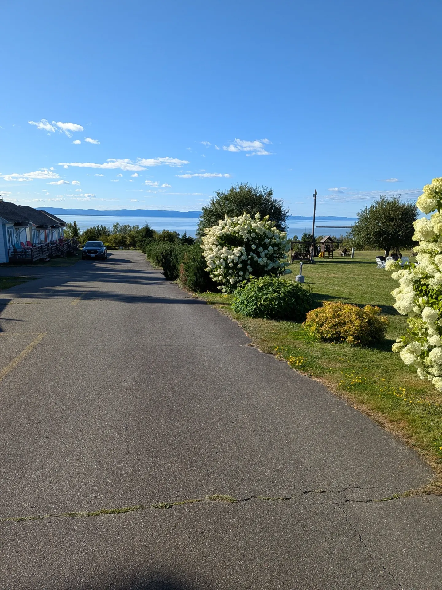 Green motel grounds above the Saint Lawrence River in Rivière-du-Loup