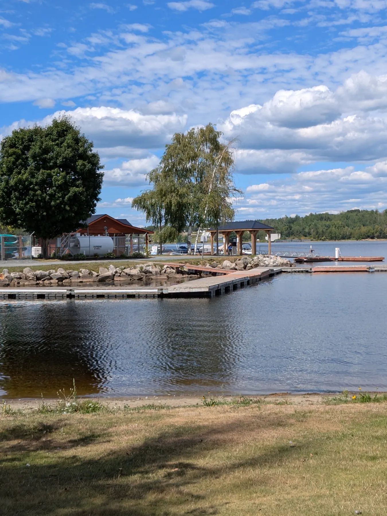 The Nackawic waterfront docks on a partly cloudy day