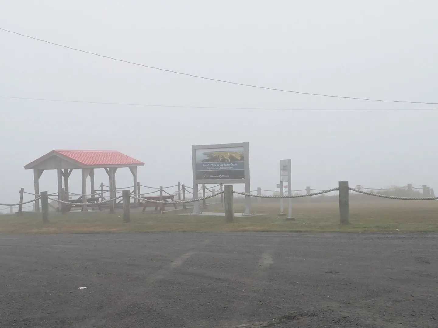A picnic shelter at the foggy Cape Saint Mary lighthouse park