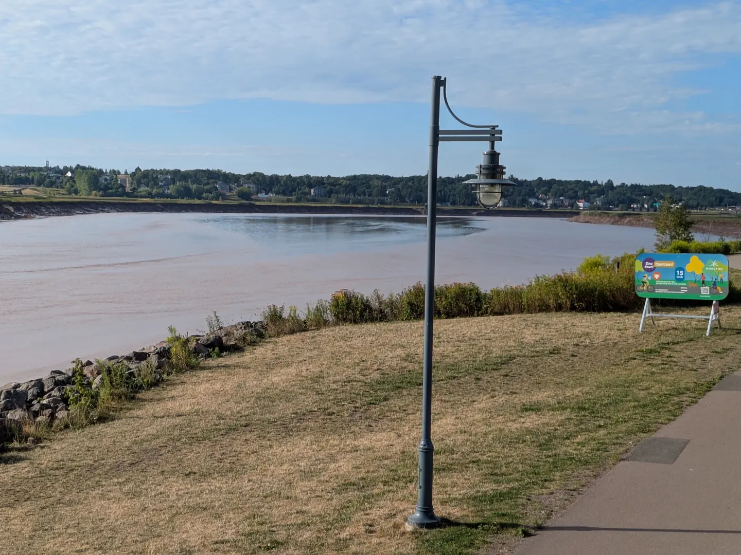 A lamp post and trail along the Moncton riverfront park
