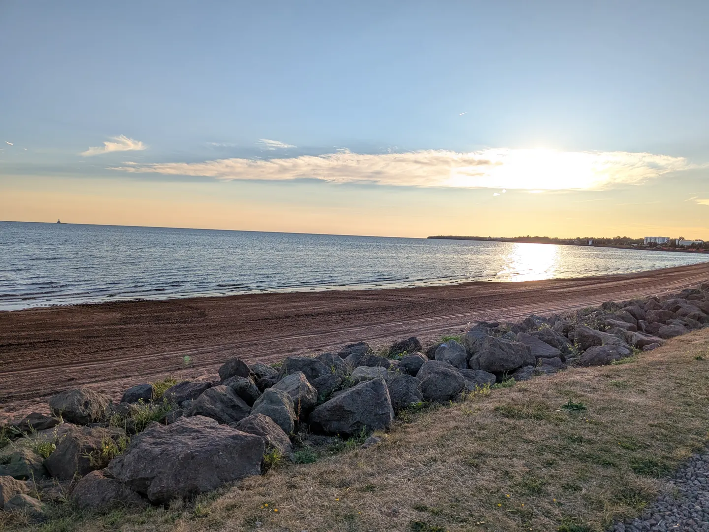 Sunset over the shoreline at Summerside Baywalk